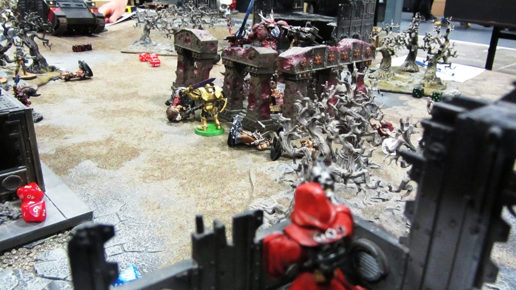 The Techpriest's covering fire proves inadequate against the daemon engine