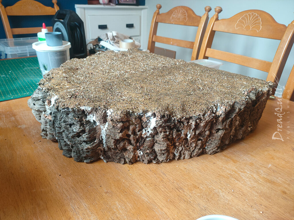 WIP ash waste modular hills with a face made of raw cork bark, covered in PVA and sand
