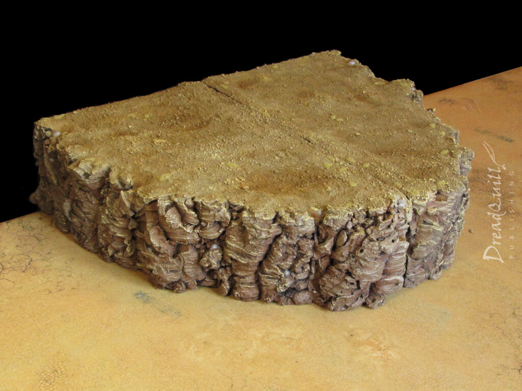 Ash waste modular hills painted a sandy brown against a black background