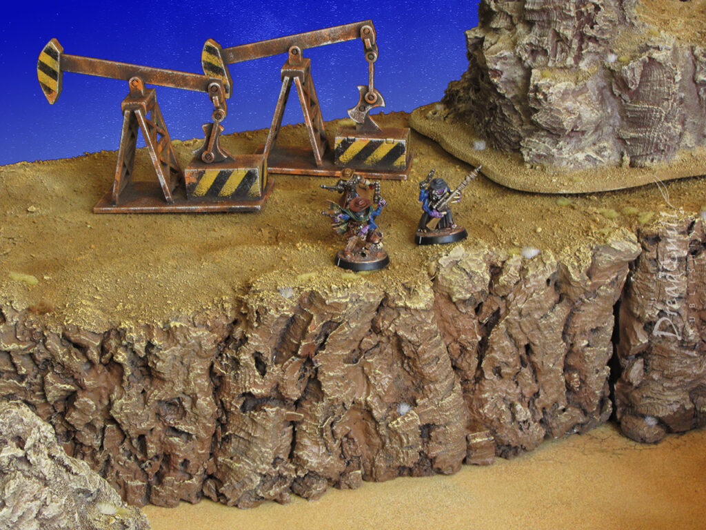 ash waste modular hills with three genestealer cultists wearing cowboy hats for scale